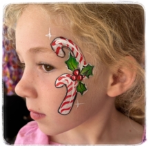 Candy canes with holly leaves face painting