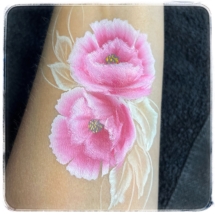 Flower face paint on arm