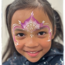 Princess face paint for a smiley girl at Papamoa Tasman Holiday park, Tauranga