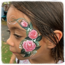 Rose face painting on a girl in Tauranga