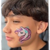 Unicorn face painting tauranga on a young boy