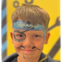 Pirate face painting at Tauranga Crossing school holiday programme