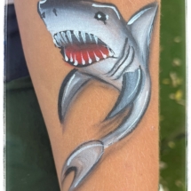 Shark face painting on an arm. Shark face painting on an arm.