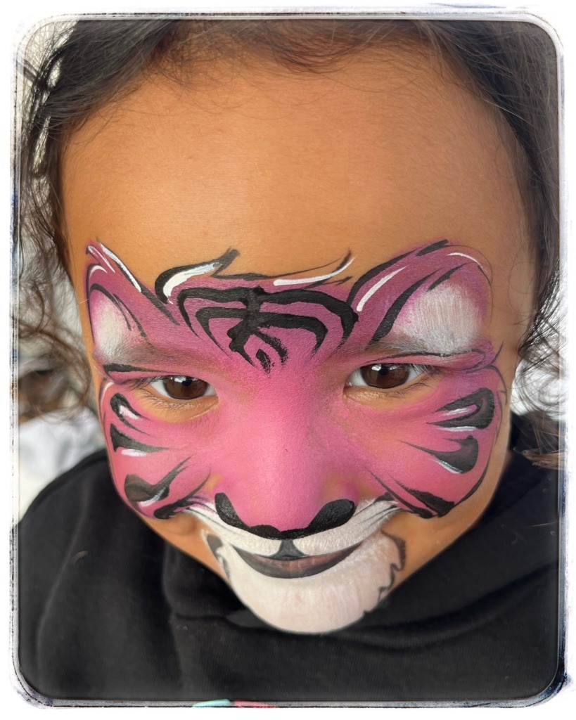 Pink tiger face paint - Kids face painting at Tauranga Triathlon event