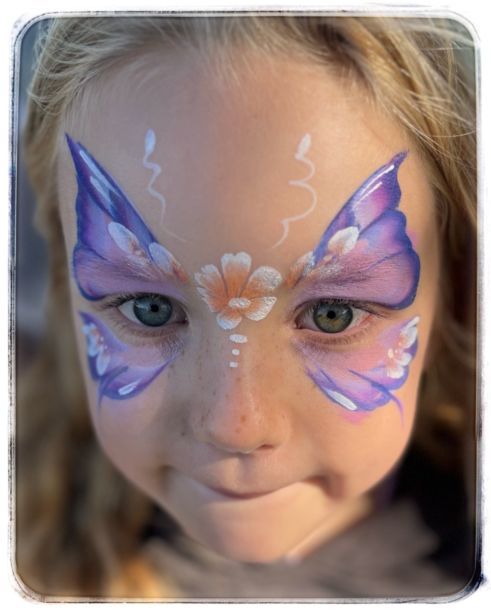 purple butteffly on a girl at a tauranga event