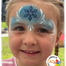 Child with a Frozen-inspired face painting at a Tauranga event